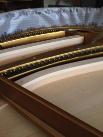 Réparation d'un piano à queue dans notre atelier à Cossonay